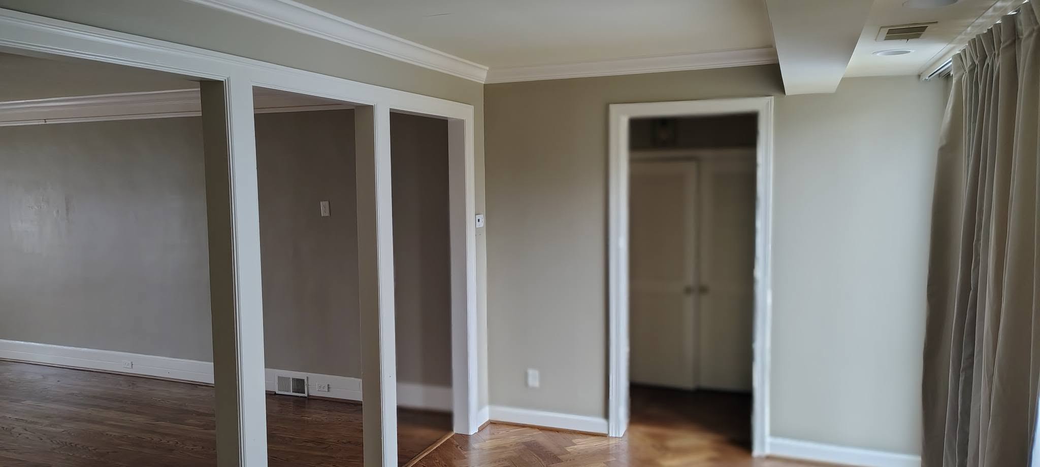 Living room with fresh gray paint and crown molding