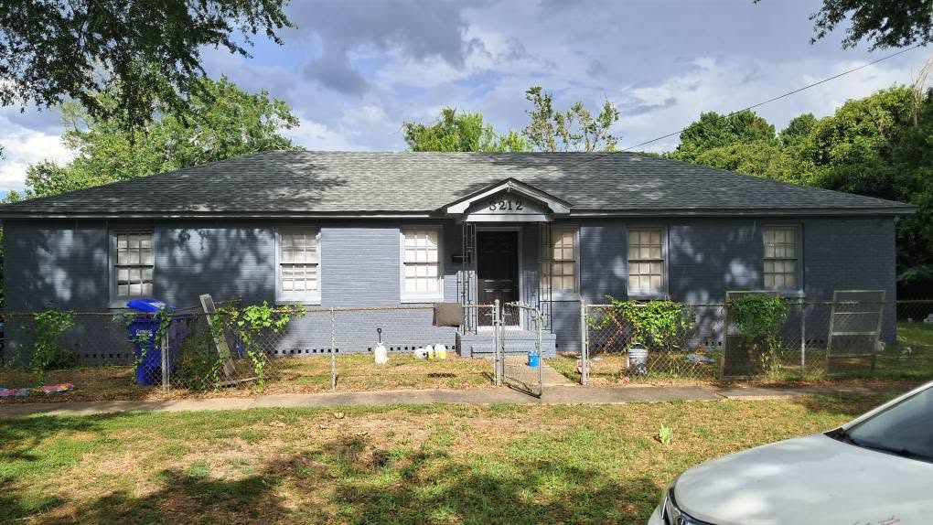 New gray shingle roof after replacement